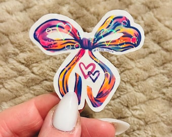 holographic rainbow coquette bow sticker | gay coquette rainbow lgbtqia+ pride sticker