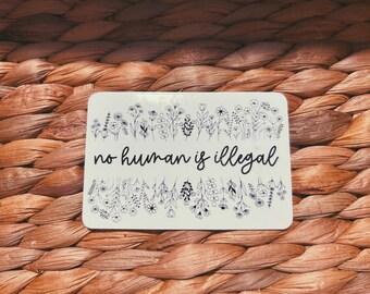 clear "no human is illegal" sticker  |  simple transparent floral sticker (CHIRLA collection)