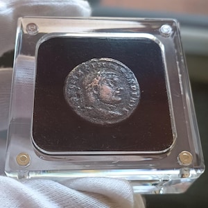 Display case with a genuine ancient Roman coin #187