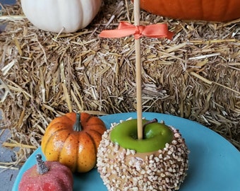 Fake Caramel Green Apple. Halloween Fake Candy Apple with Fake Nuts. Carnival Candy Apple Collection