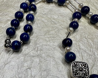 Lapis and silver necklace accented with pearls.