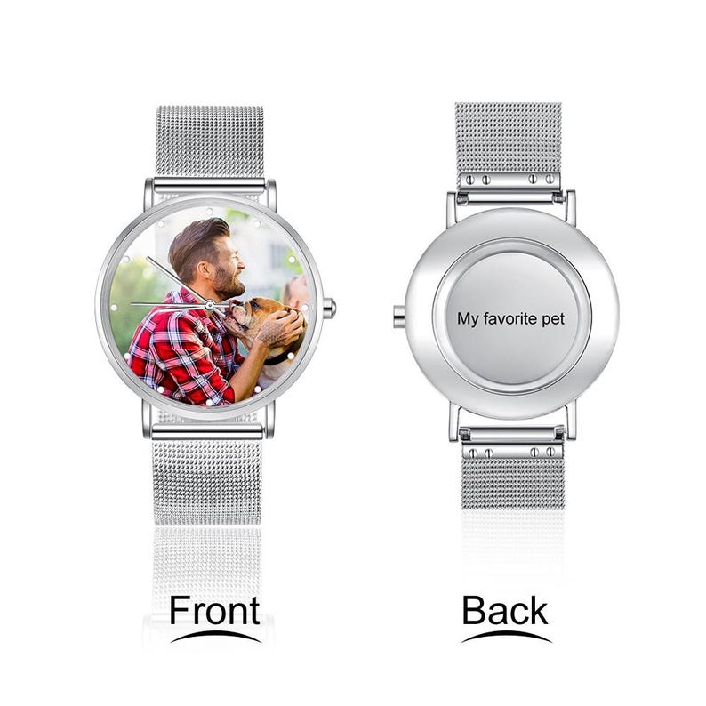 May include: A silver wristwatch with a mesh band. The watch face displays a photo of a person with a dog. The back of the watch is silver and has the text "My favorite pet".