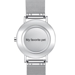 May include: A silver wristwatch with a mesh band and a round face. The watch face has the text "My favorite pet" in black. The watch has a minimalist design.
