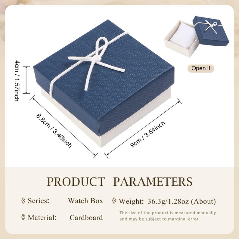 May include: A navy blue watch box with a white base, tied with a white string. The box measures 3.54 inches by 3.46 inches and is 1.57 inches tall. The box is made of cardboard and weighs 1.28 oz.