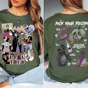 a woman wearing a green shirt with pictures of cartoon characters on it