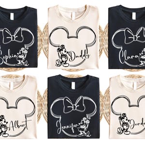 a set of four mickey mouse shirts