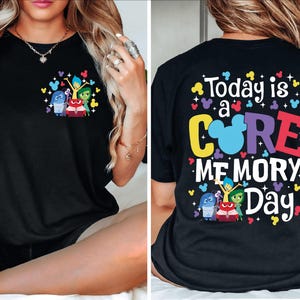 May include: Black t-shirt with a colorful graphic of characters from the movie Inside Out. The back of the shirt says "Today is a CORE MEMORY Day" with a Mickey Mouse head in the middle of the word "CORE".