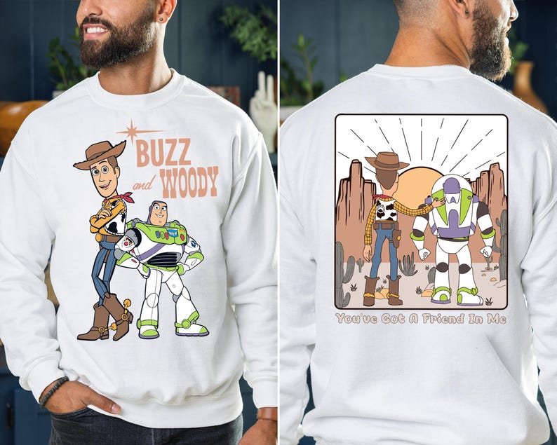 a man wearing a buzz and woody sweatshirt