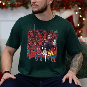 a man sitting on a couch in front of a christmas tree