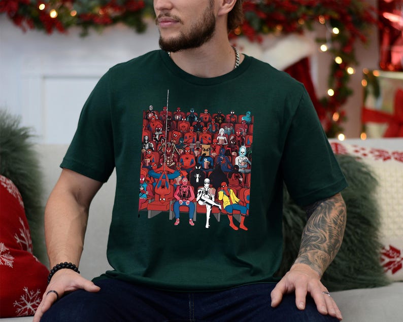 a man sitting on a couch in front of a christmas tree