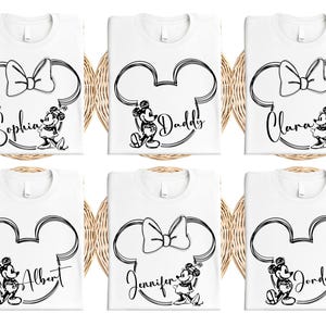 a set of four mickey mouse bibs