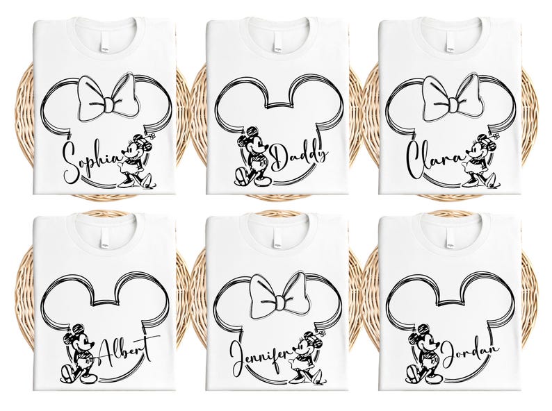 a set of four mickey mouse bibs