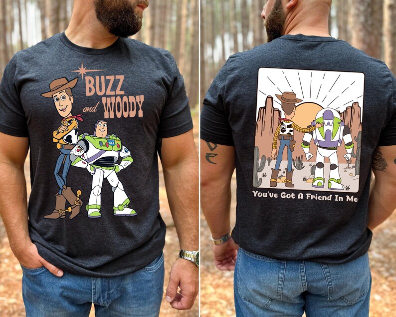 a man wearing a buzz and woody t - shirt