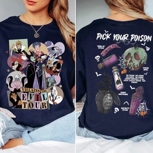 a woman sitting on top of a bed wearing a blue shirt