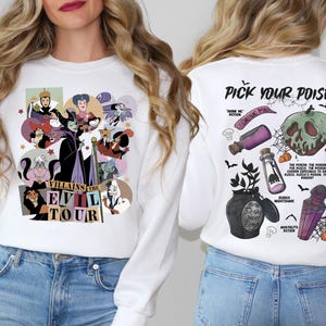 a woman wearing a white shirt with cartoon characters on it