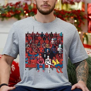 a man sitting on a couch in front of a christmas tree