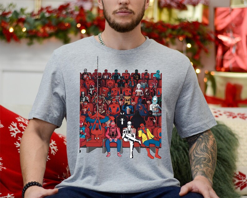 a man sitting on a couch in front of a christmas tree