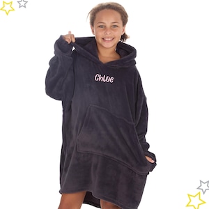 May include: A dark navy blue oversized hoodie with a large front pocket and a hood. The name "Chloe" is embroidered in pink on the chest. The hoodie is made of a soft, plush material.