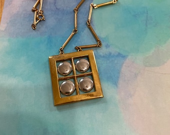 Artistry LTD Gold and Silver Tone Geometric Pendant Necklace.