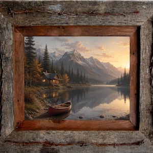 May include: A framed landscape painting depicts a serene lake scene with a cabin, mountains, and a canoe. The artwork is encased in a rustic wooden frame with barbed wire accents, creating a vintage aesthetic. The color palette includes warm sunset hues.