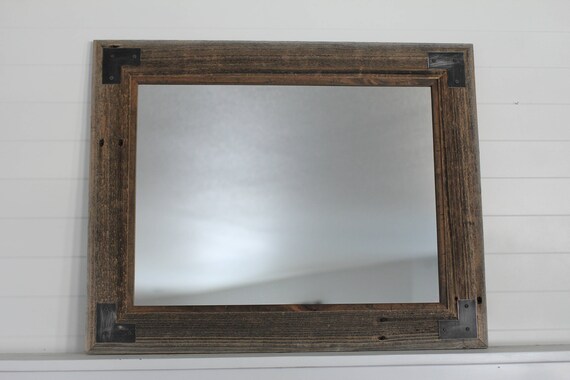 Having a mirror like this plus the wooden wall would bring a striking effect to your rustic. etsy