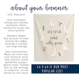 May include: A beige banner with the text "Olivia is One silly goose" and illustrations of white geese and floral accents. The banner is 50 x 60 inches and made of 100% polyester fabric.
