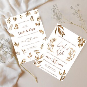 May include: Two wedding invitations with a gold leaf design. The top invitation says "Save the Date" for the wedding of Leah & Kyle on July 23, 2026. The bottom invitation says "Leah & Kyle" and invites you to join their wedding on July 23, 2026.
