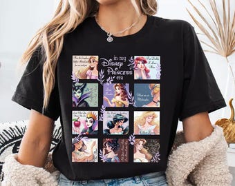 May include: Black t-shirt featuring a grid of Disney Princesses with the text "in my Disney Princess era." Each square showcases a different princess with a quote. The shirt is a casual wear item.