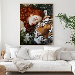 May include: A painting of a woman with long red hair sleeping next to a tiger. The woman is wearing a white dress and the tiger is brown and orange with black stripes. The background is green and leafy.