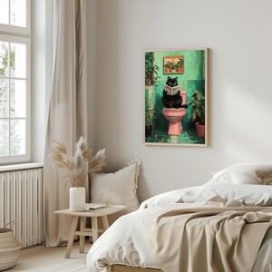 May include: A black cat sits on a pink toilet in a green tiled bathroom, reading a newspaper. The bathroom has plants and a window.