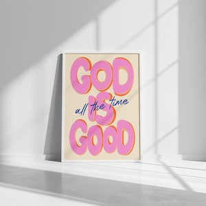 Può includere: Un poster incorniciato bianco con sfondo beige e testo rosa che dice "GOD IS GOOD" con le parole "all the time" in blu sotto.
