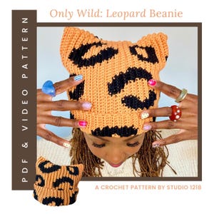 May include: A crochet beanie with a tan and black leopard print pattern and two pointed cat-ear style corners. The text reads Only Wild: Leopard Beanie and A CROCHET PATTERN BY STUDIO 1218. PDF & VIDEO PATTERN is written vertically.