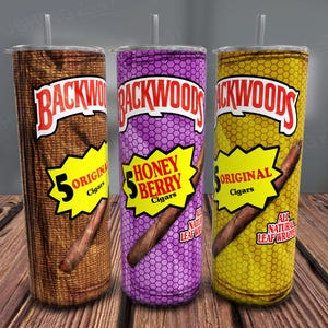 May include: Three stainless steel tumblers with different Backwoods cigar designs. The tumblers are brown, purple, and yellow with the text "Backwoods" and "5" on each. The brown tumbler has the text "Original Cigars", the purple tumbler has the text "Honey Berry Cigars", and the yellow tumbler has the text "Original Cigars".