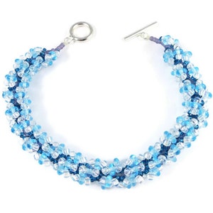 50% RABATT REA Handpärlad armband med spiralmönster, pärlvävning, aquaglas rondeller, turkosa violetta pärlor, violett lås, 8 1/8" 20,5 CM