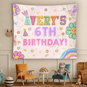 May include: A pink and white birthday banner with glitter accents. The banner says "Avery's 6th Birthday!" with rainbow, flower, and star decorations.