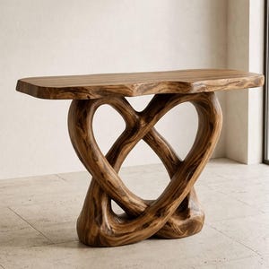 May include: A console table crafted from natural brown wood with a smooth, rectangular top and a base featuring two intertwined, sculptural supports that form a continuous, fluid loop design with visible wood grain patterns throughout the structure.