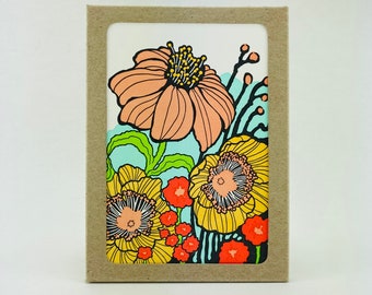 It's time for Poppies! Dark chocolate frames candy apple red and yellow poppies. Box set of 6 cards and envelopes.