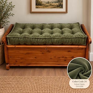 May include: A rectangular olive green tufted velvet bench cushion with a thick, box-edge construction. The cushion features a soft, plush texture with a 250 GSM weight, identified as Color Code 24, resting atop a wooden storage chest.