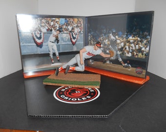 McFarlane Brooks Robinson in his White Jersey (Unopened Packaging ) + Loose Gray Variant Jersey.