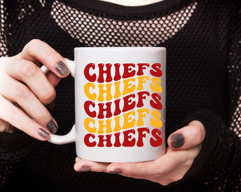 May include: White ceramic mug with the word "CHIEFS" repeated five times in a retro font. The text is in red and yellow.