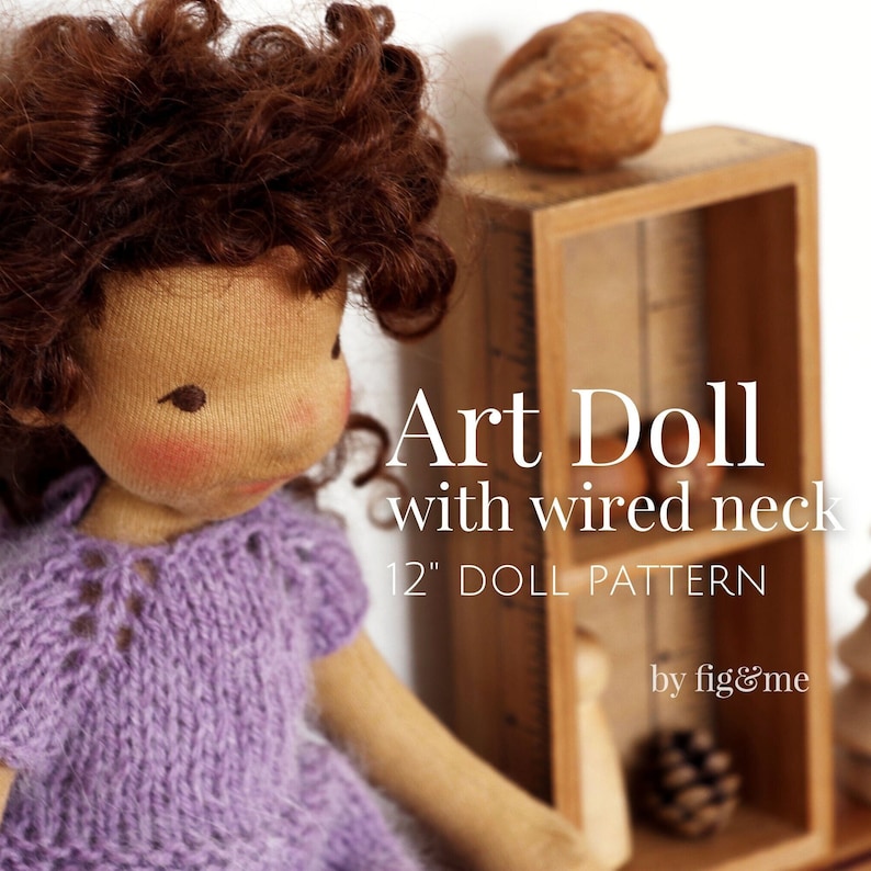 May include: A 12-inch art doll pattern with a wired neck. The doll is wearing a purple knitted sweater. The pattern is by fig&me.