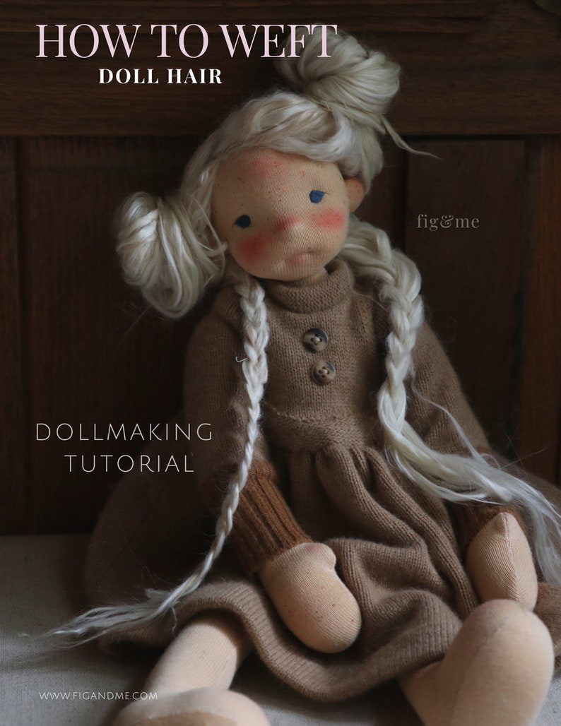 May include: A doll with blonde hair in braids, wearing a brown sweater dress and sitting on a wooden surface. The text "HOW TO WEFT DOLL HAIR" is at the top of the image, and the text "DOLLMAKING TUTORIAL" is below the doll. The text "fig&me" is in the upper right corner of the image.