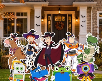 May include: A collection of Halloween-themed yard signs featuring cartoon characters including a horse, a cowgirl, a cowboy, a space ranger, a dinosaur, a camera, a frog, a blue creature, and a white device, all wearing festive costumes.