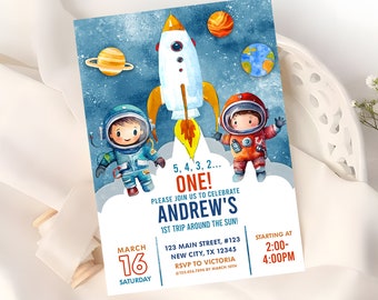 May include: A blue and white astronaut birthday party invitation with a rocket ship, planets, and two astronauts. The text reads "5, 4, 3, 2... ONE! Please join us to celebrate Andrew's 1st trip around the sun!"  March 16, Saturday, 123 Main Street, #123, New City, TX 12345, RSVP to Victoria, 123-456-7890 by March 10th, Starting at 2:00-4:00PM.