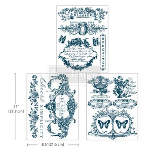 May include: A set of three decorative transfer sheets with vintage-style designs in navy blue. The sheets feature floral elements, butterflies, ornate frames, and text including "Blessed," "Beautiful," and "Cheers Simplicity." The sheets measure 8.5" x 11".