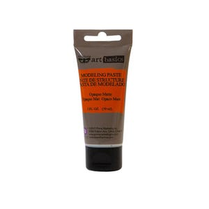 May include: A taupe-colored squeeze tube of Art Basics Modeling Paste with a black cap. The label features an orange rectangular section with the text Modeling Paste, Opaque Matte, and 2 fl. oz. (59 ml) printed in black lettering.