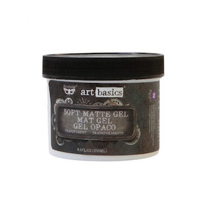 May include: A white container of Art Basics Soft Matte Gel with a black lid. The label includes the text "SOFT MATTE GEL" and "8.5 fl oz (250ml)". The product is transparent.