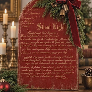 May include: A red arched wooden sign featuring gold cursive text that reads Silent Night. The sign is decorated with a dark red velvet ribbon bow, green pine branches, and two small metallic bells attached to the upper right corner.