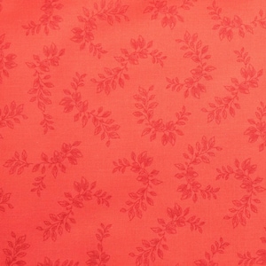 May include: A vibrant coral-coloured fabric featuring a repeating pattern of delicate, darker coral-toned leafy vine motifs scattered across the surface. The design consists of small, detailed sprigs of foliage arranged in a consistent, flowing layout.