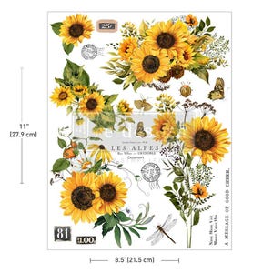Puede incluir: Una hoja de transferencia decorativa de 27,9 cm por 21,5 cm con girasoles amarillos, follaje verde, mariposas, una libélula y un escarabajo. El diseño incluye sellos postales, el texto LES ALPES y A MESSAGE OF GOOD CHEER.